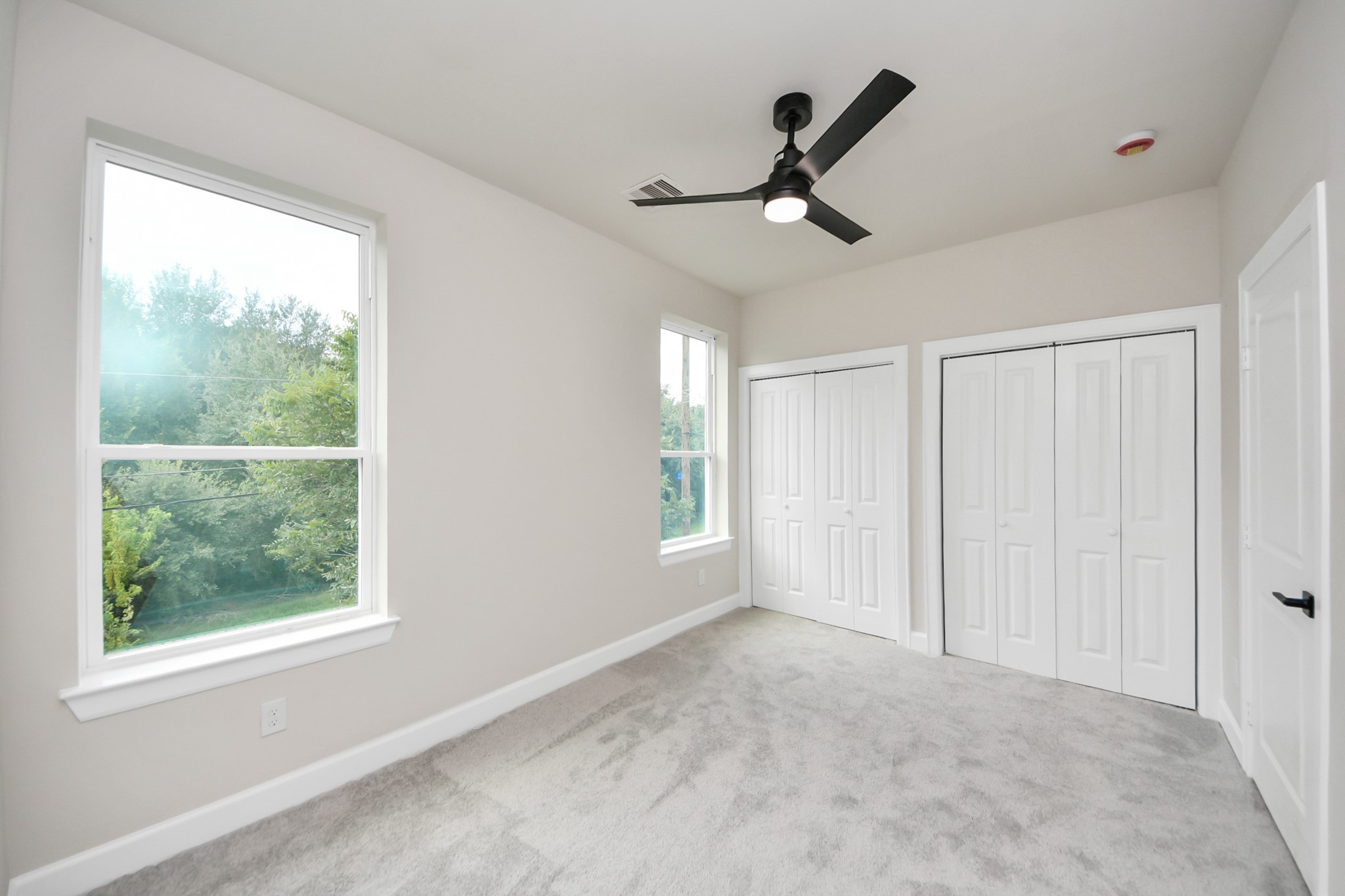3110 Dawson Lane, Unit A Houston, TX 77051 - Photo 20 of 32 a view of an empty room and window ceiling fan