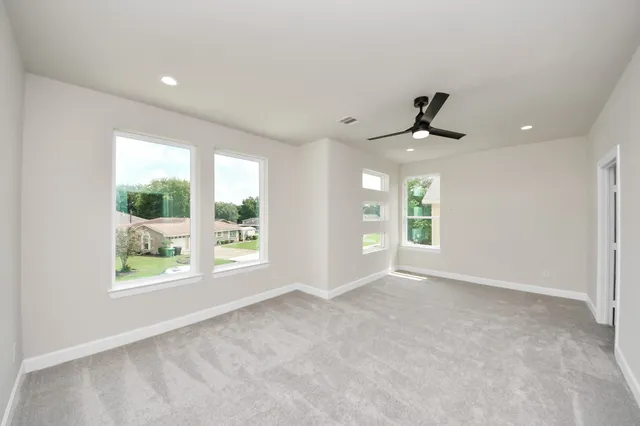 a view of an empty room with a window