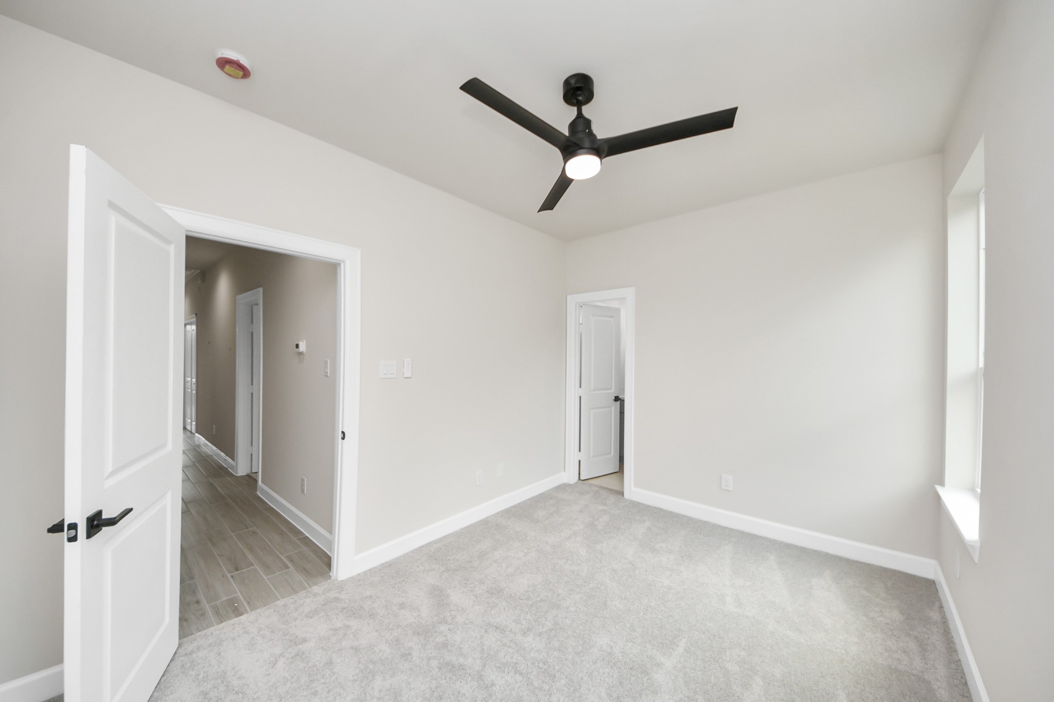 3110 Dawson Lane, Unit A Houston, TX 77051 - Photo 26 of 32 a view of a hallway with a ceiling fan