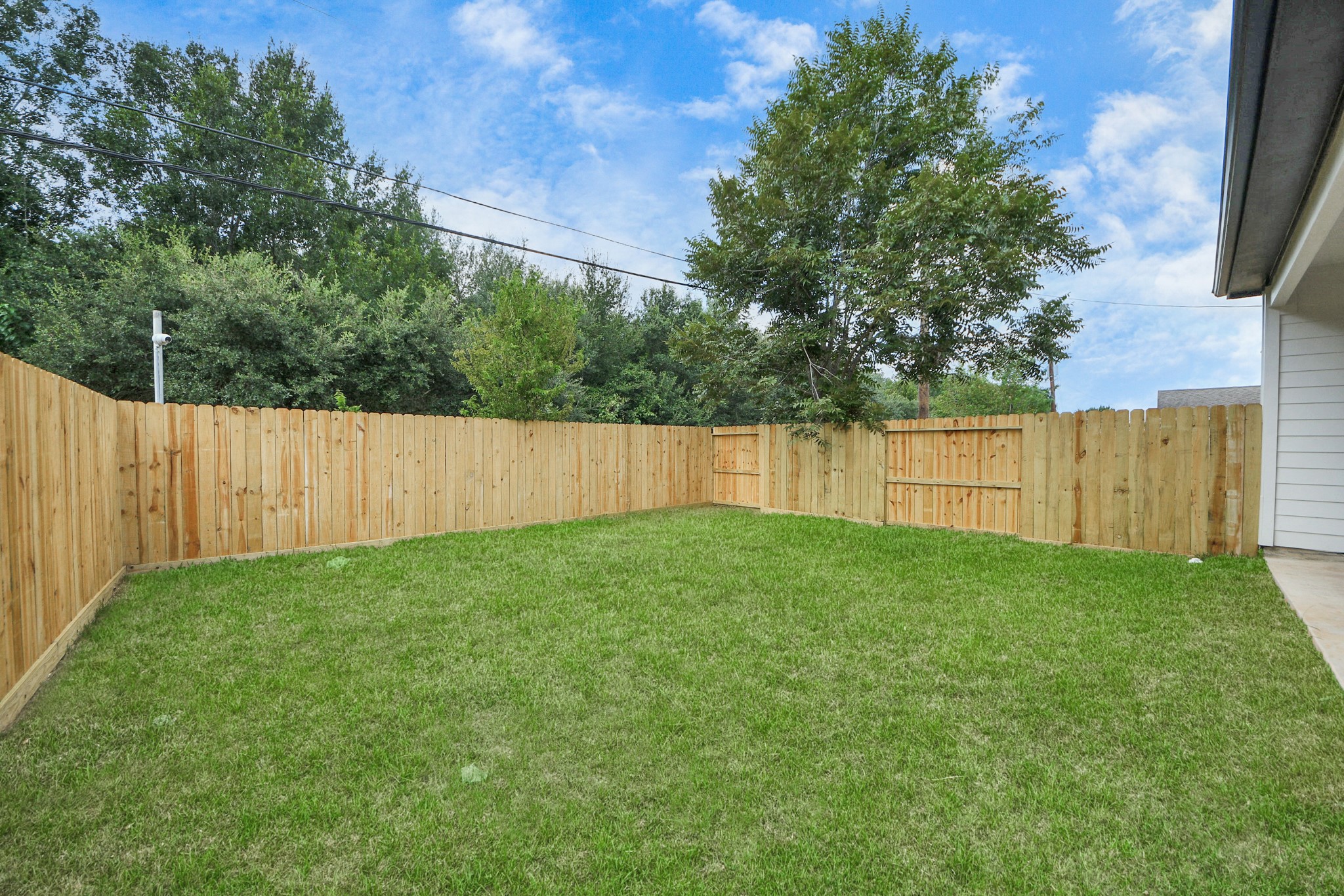 3110 Dawson Lane, Unit A Houston, TX 77051 - Photo 31 of 32 a view of a backyard with wooden fence