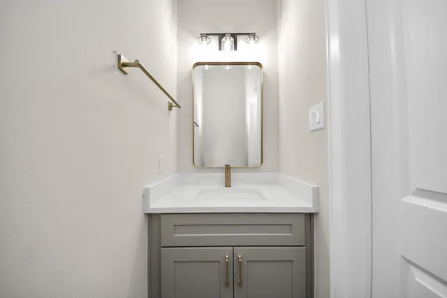 a sink with a mirror