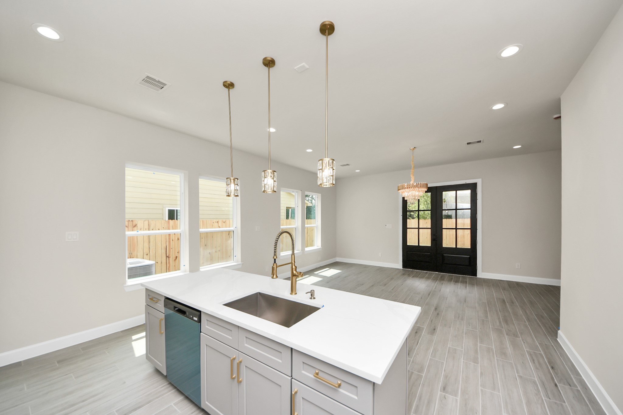 3110 Dawson Lane, Unit A Houston, TX 77051 - Photo 7 of 32 a kitchen with a sink a counter space appliances and cabinets