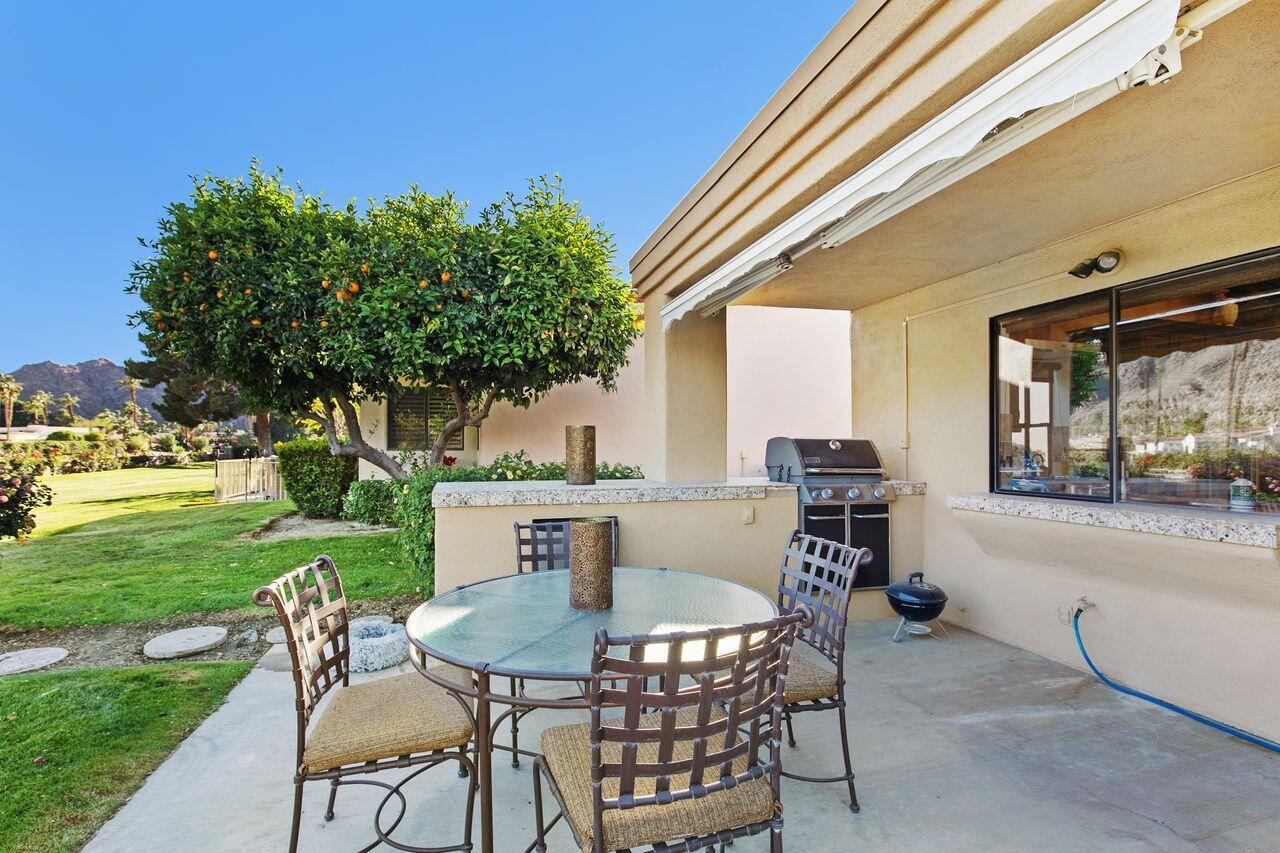 45250 Vista Santa Rosa Indian Wells, CA 92210 - Photo 26 of 28 a view of a patio with a table and chairs