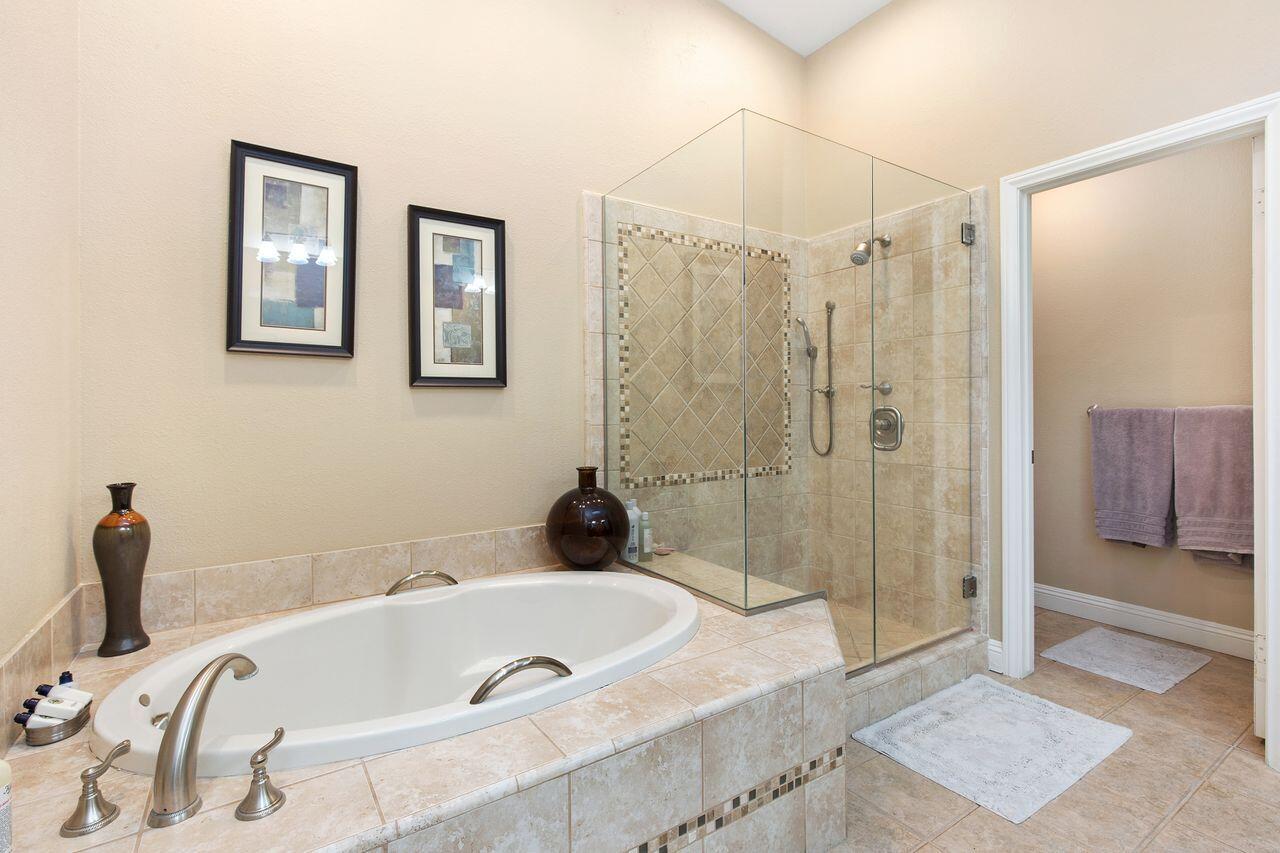 45250 Vista Santa Rosa Indian Wells, CA 92210 - Photo 7 of 28 a bathroom with a tub a sink and shower