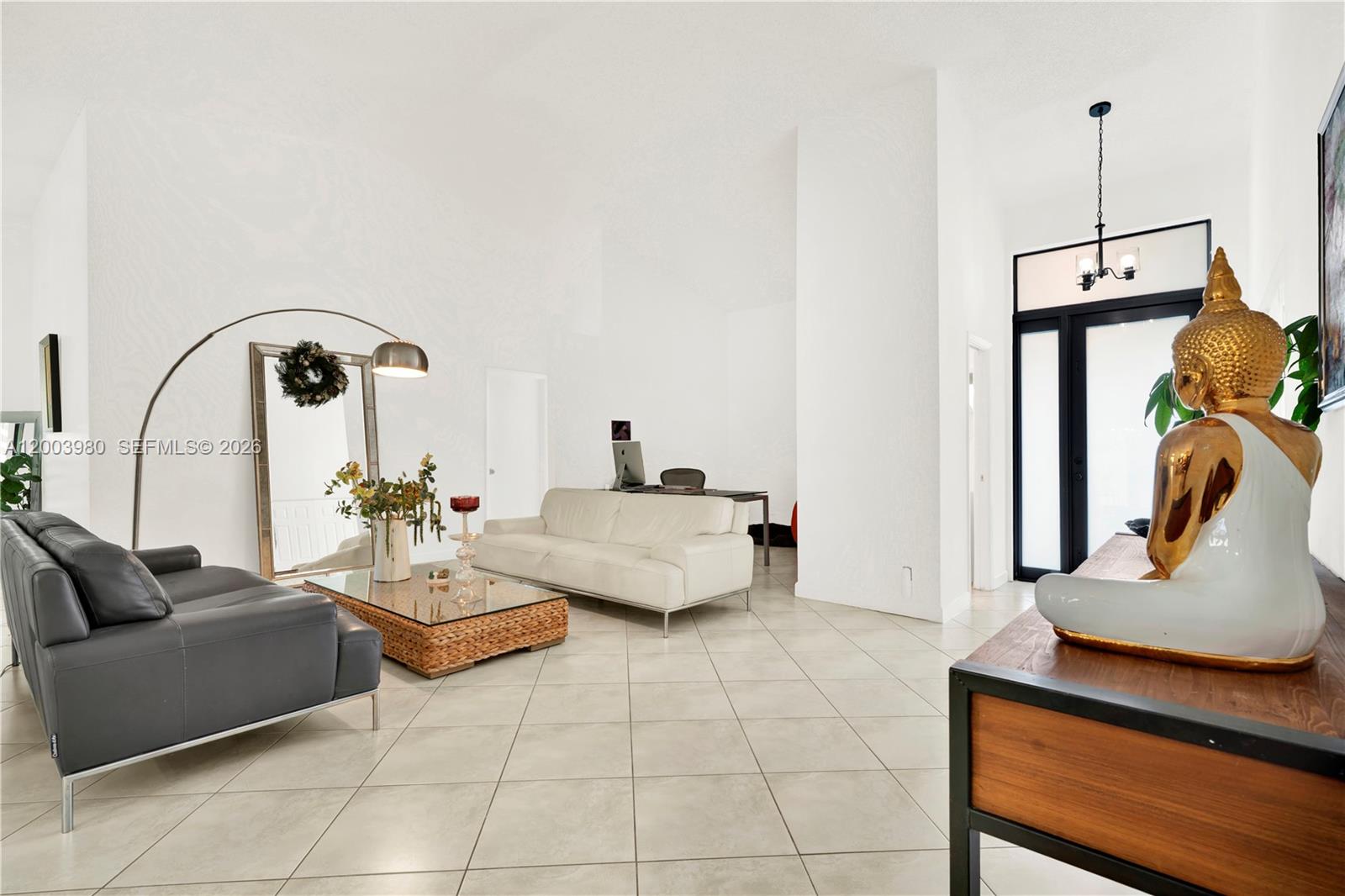 12221 Southwest 93rd Street Miami, FL 33186 - Photo 12 of 41 a living room with furniture and a potted plant