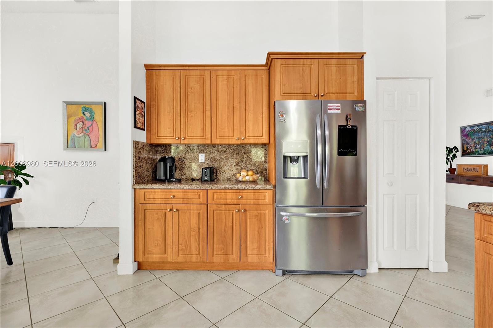 12221 Southwest 93rd Street Miami, FL 33186 - Photo 14 of 41 a kitchen with stainless steel appliances granite countertop a refrigerator and a stove