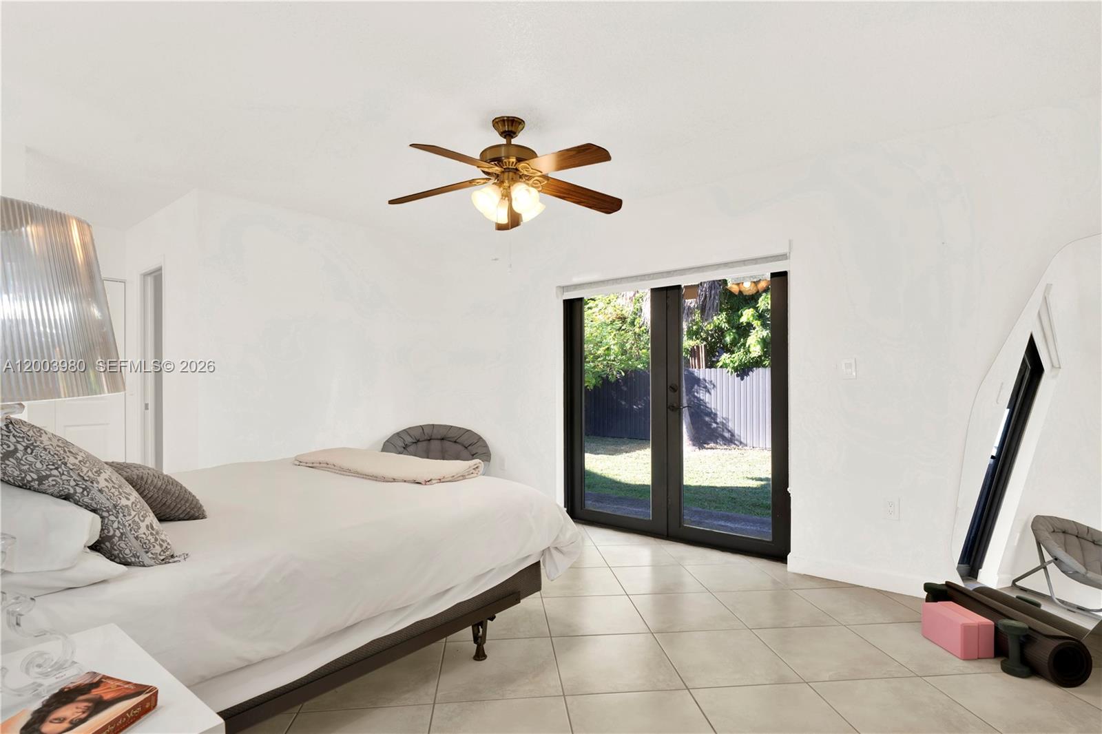 12221 Southwest 93rd Street Miami, FL 33186 - Photo 28 of 41 a bedroom with a bed and a window