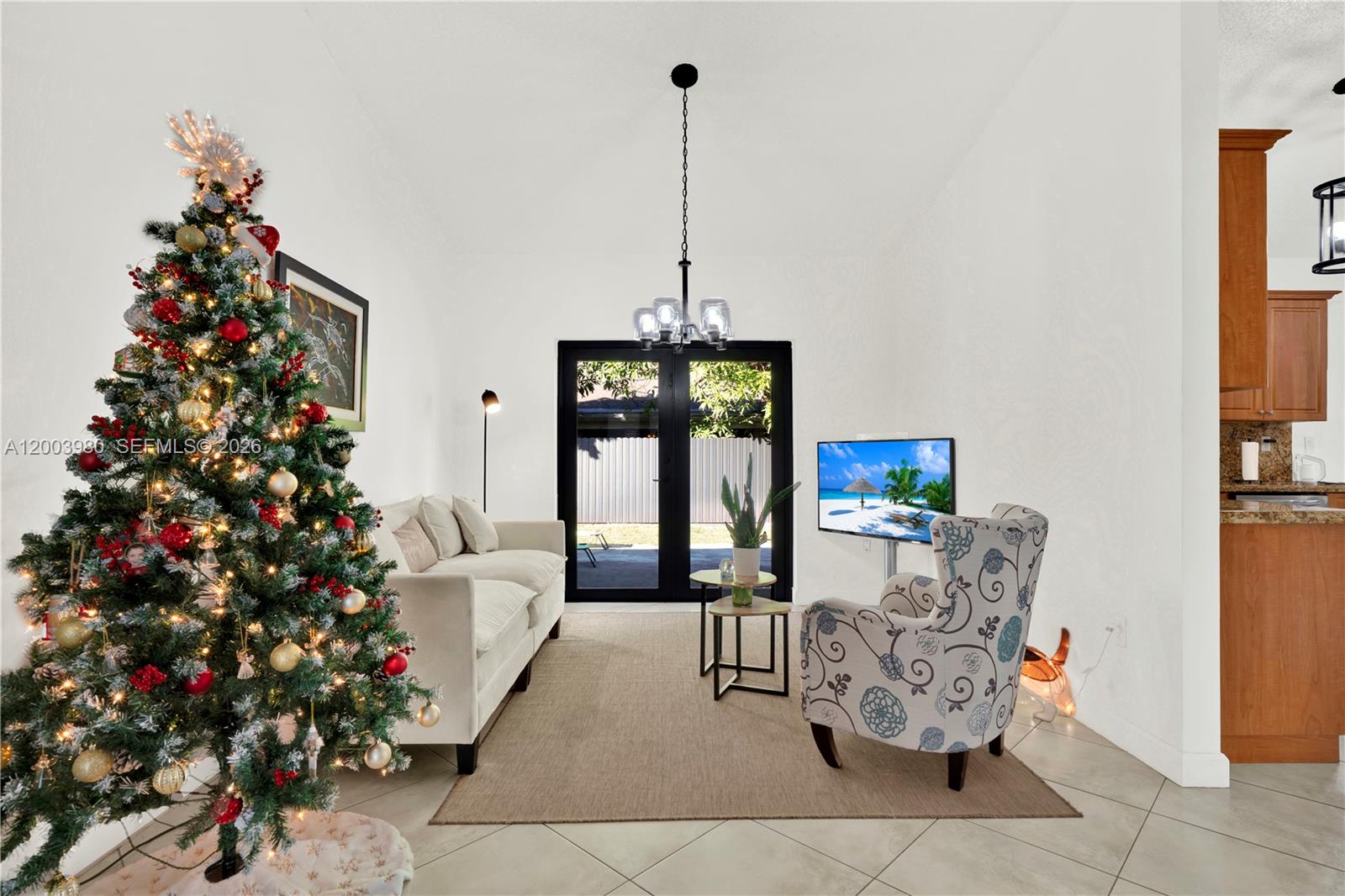 12221 Southwest 93rd Street Miami, FL 33186 - Photo 3 of 41 a living room with furniture and a potted plant