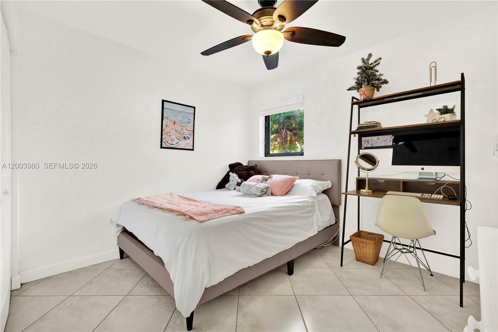 12221 Southwest 93rd Street Miami, FL 33186 - Photo 34 of 41 a bedroom with a bed and a chandelier