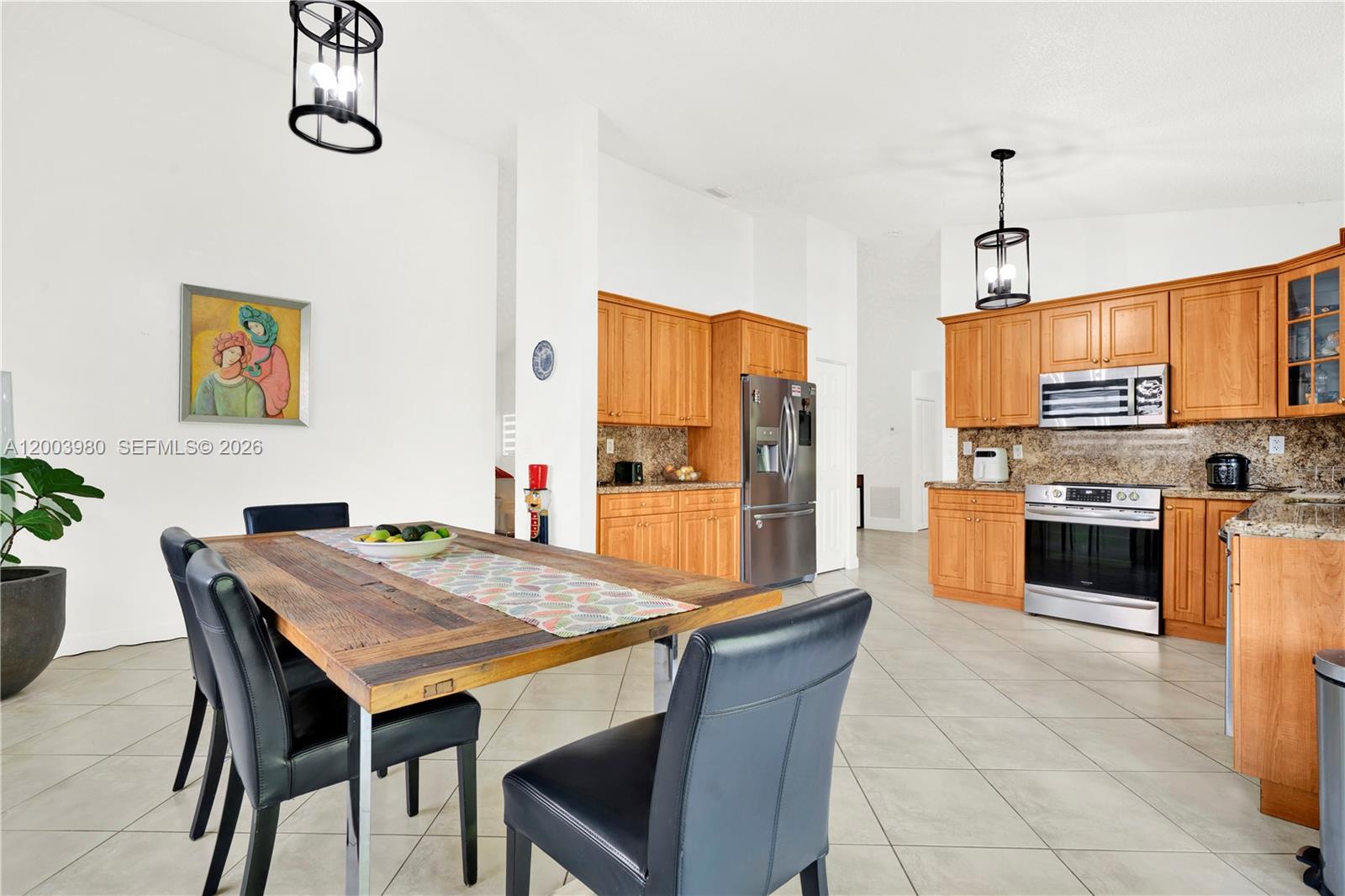 12221 Southwest 93rd Street Miami, FL 33186 - Photo 7 of 41 a view of kitchen with furniture and wooden floor