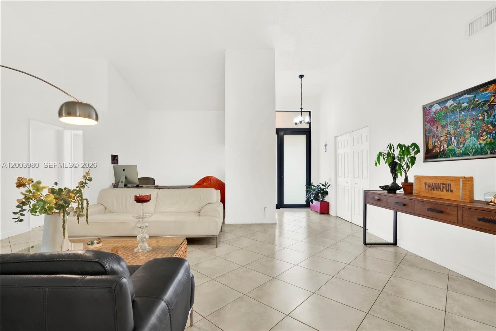 12221 Southwest 93rd Street Miami, FL 33186 - Photo 8 of 41 a living room with furniture and a potted plant
