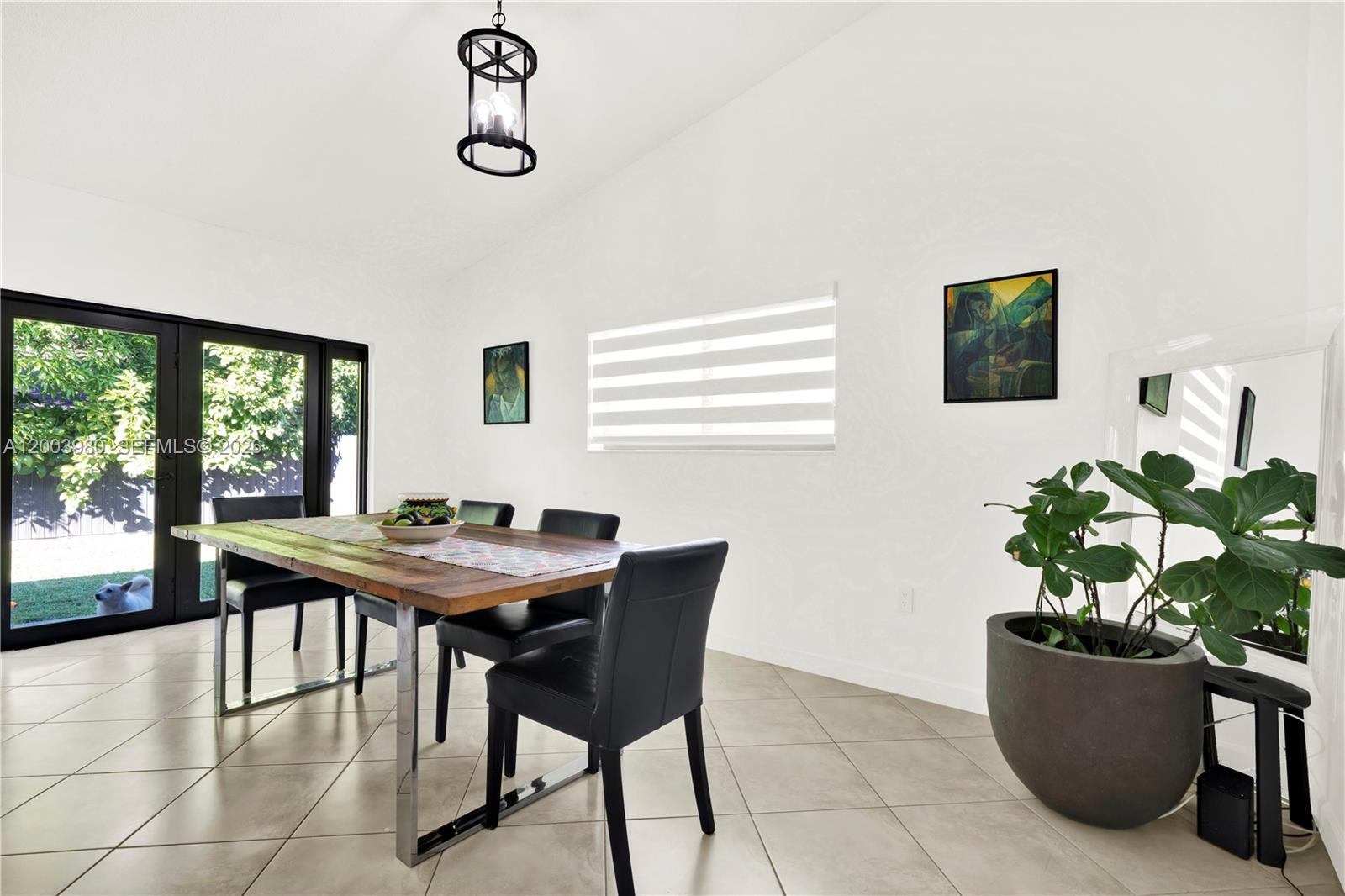 12221 Southwest 93rd Street Miami, FL 33186 - Photo 9 of 41 a dining room with furniture and window