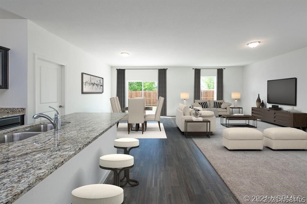 3527 Fernanda Drive Deltona, FL 32738 - Photo 2 of 9 a living room with furniture and a couch