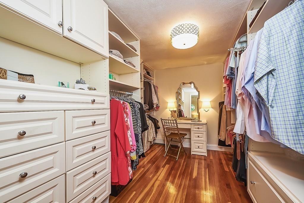 236 Hayward Mill Road Concord, MA 01742 - Photo 11 of 26 a view of walk in closet with clothes and shoes