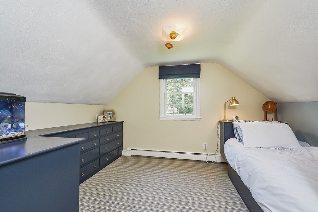236 Hayward Mill Road Concord, MA 01742 - Photo 18 of 26 a bedroom with a bed and a window