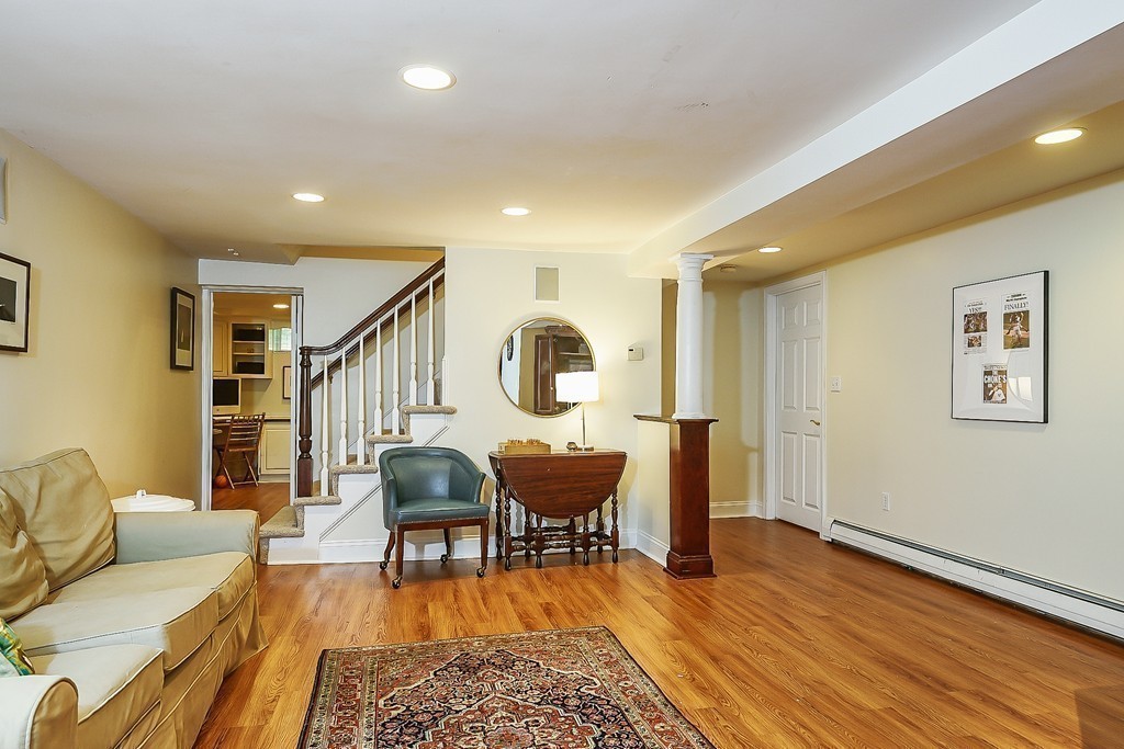 236 Hayward Mill Road Concord, MA 01742 - Photo 20 of 26 a living room with furniture and a wooden floor