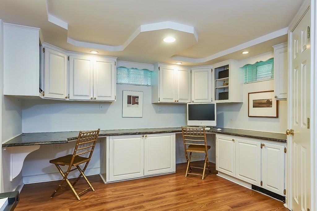 236 Hayward Mill Road Concord, MA 01742 - Photo 21 of 26 a kitchen with a cabinets and chairs in it