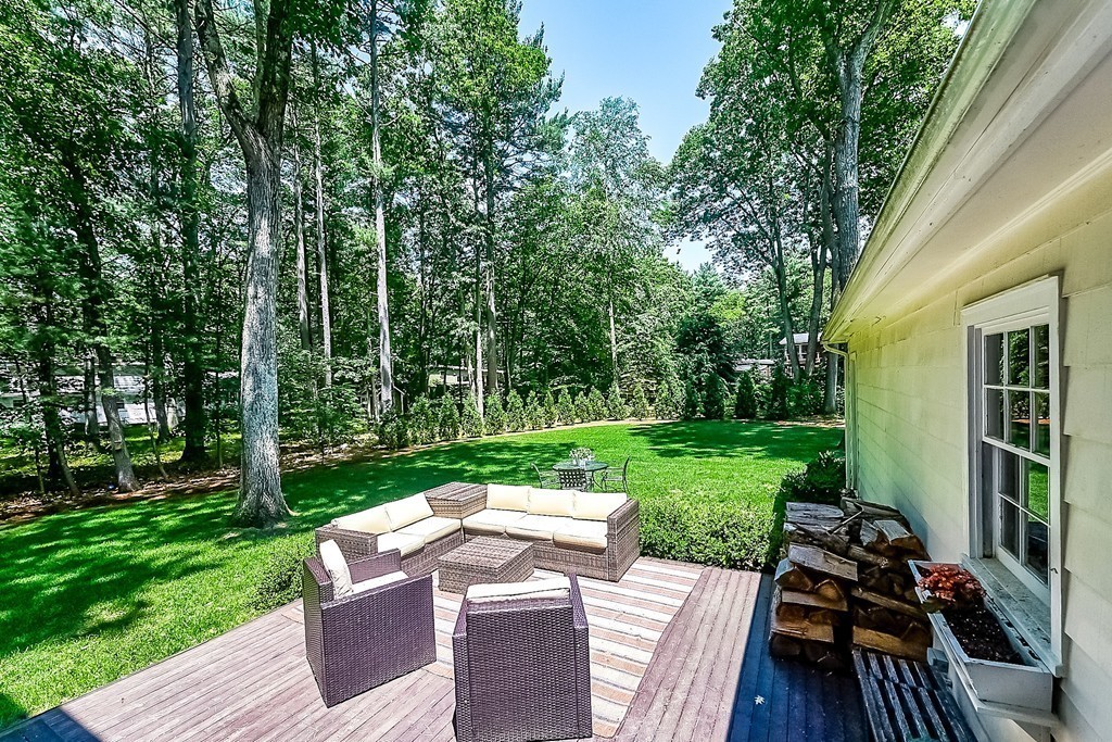 236 Hayward Mill Road Concord, MA 01742 - Photo 22 of 26 a view of a wooden deck and a yard