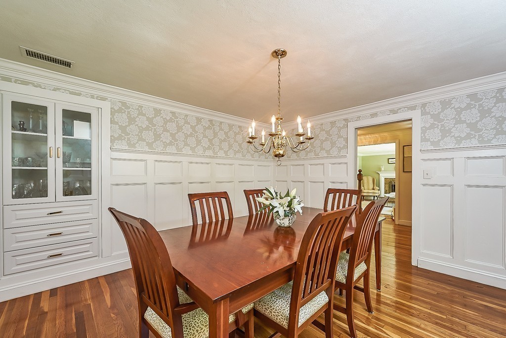 236 Hayward Mill Road Concord, MA 01742 - Photo 4 of 26 a view of a dining room with furniture wooden floor and chandelier