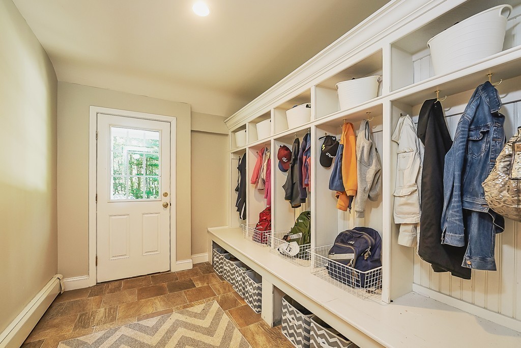 236 Hayward Mill Road Concord, MA 01742 - Photo 9 of 26 a view of walk in closet with clothes and shoes