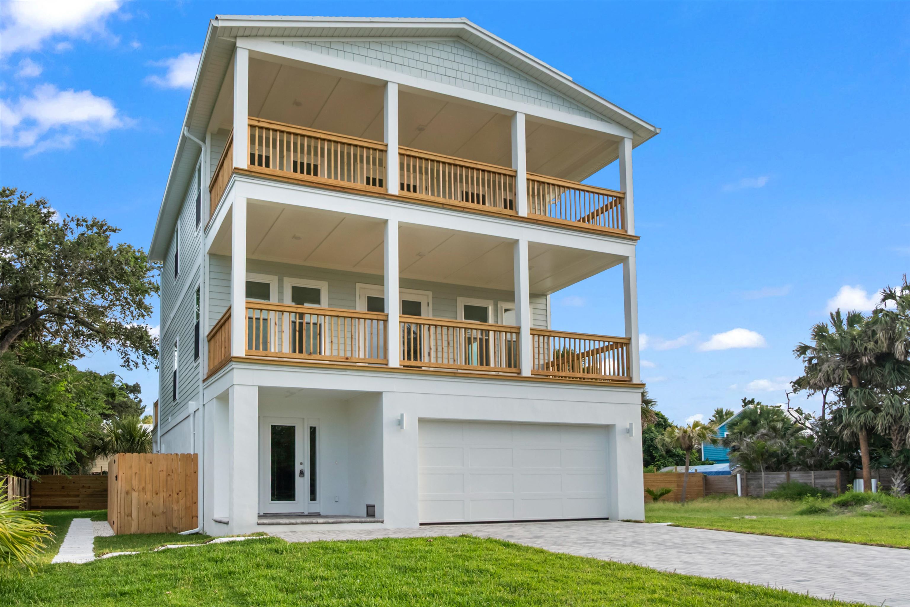 137 Ferrol Road St. Augustine, FL 32084 - Photo 14 of 55 a front view of a house with a yard and garage