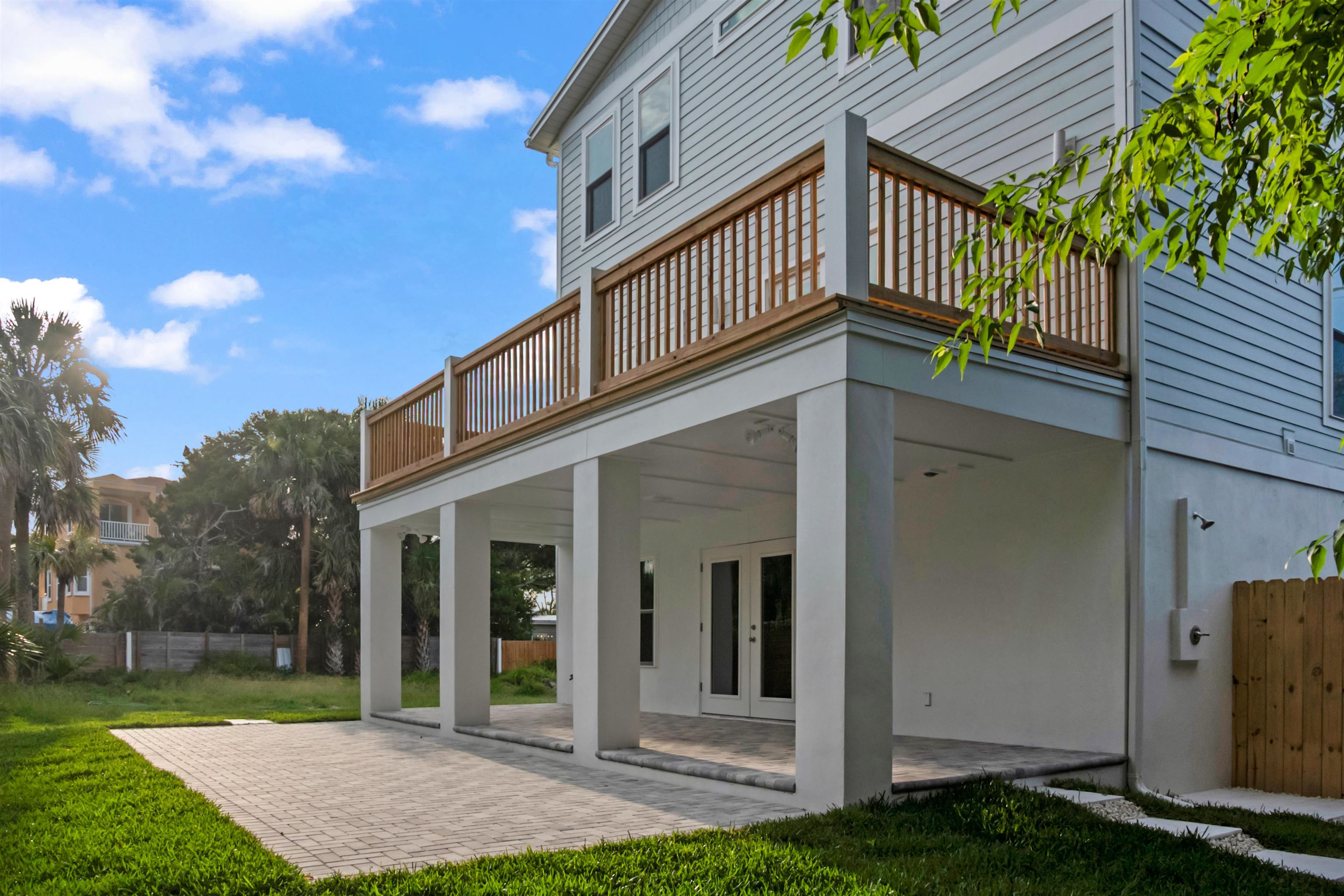 137 Ferrol Road St. Augustine, FL 32084 - Photo 16 of 55 a view of a house with brick walls and a yard with plants