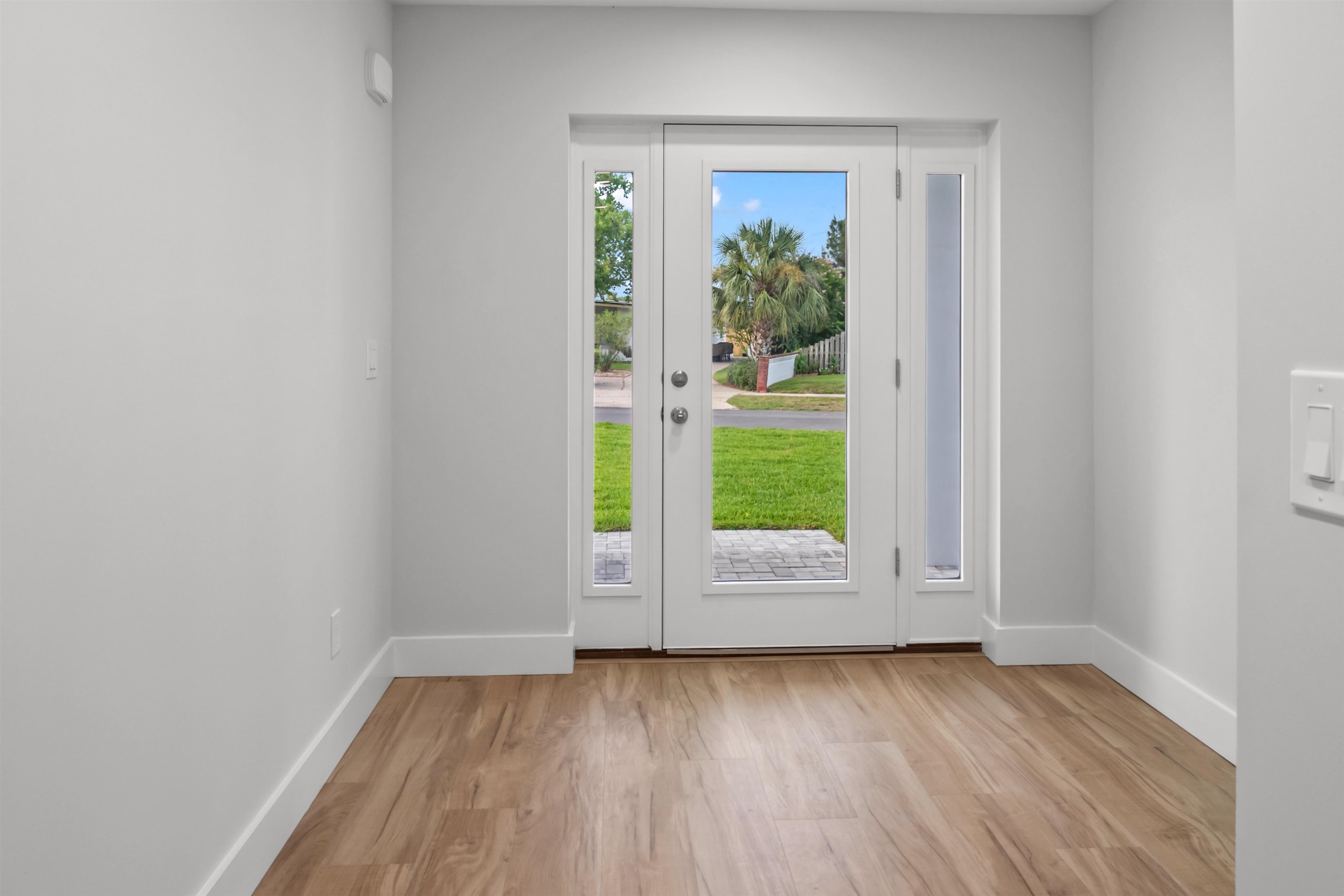 137 Ferrol Road St. Augustine, FL 32084 - Photo 23 of 55 an empty room with wooden floor and windows