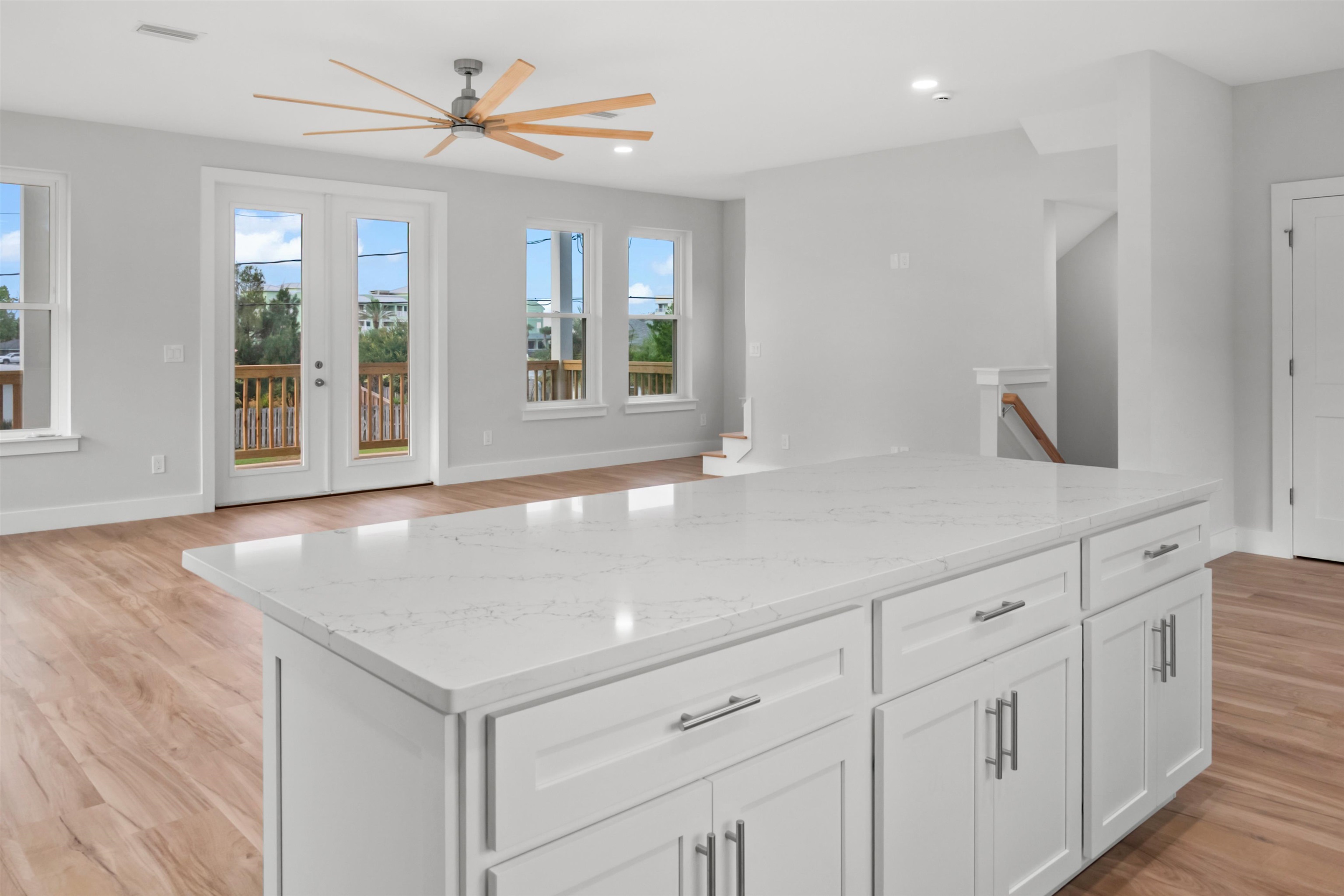 137 Ferrol Road St. Augustine, FL 32084 - Photo 29 of 55 a view of a kitchen with center island and wooden floor
