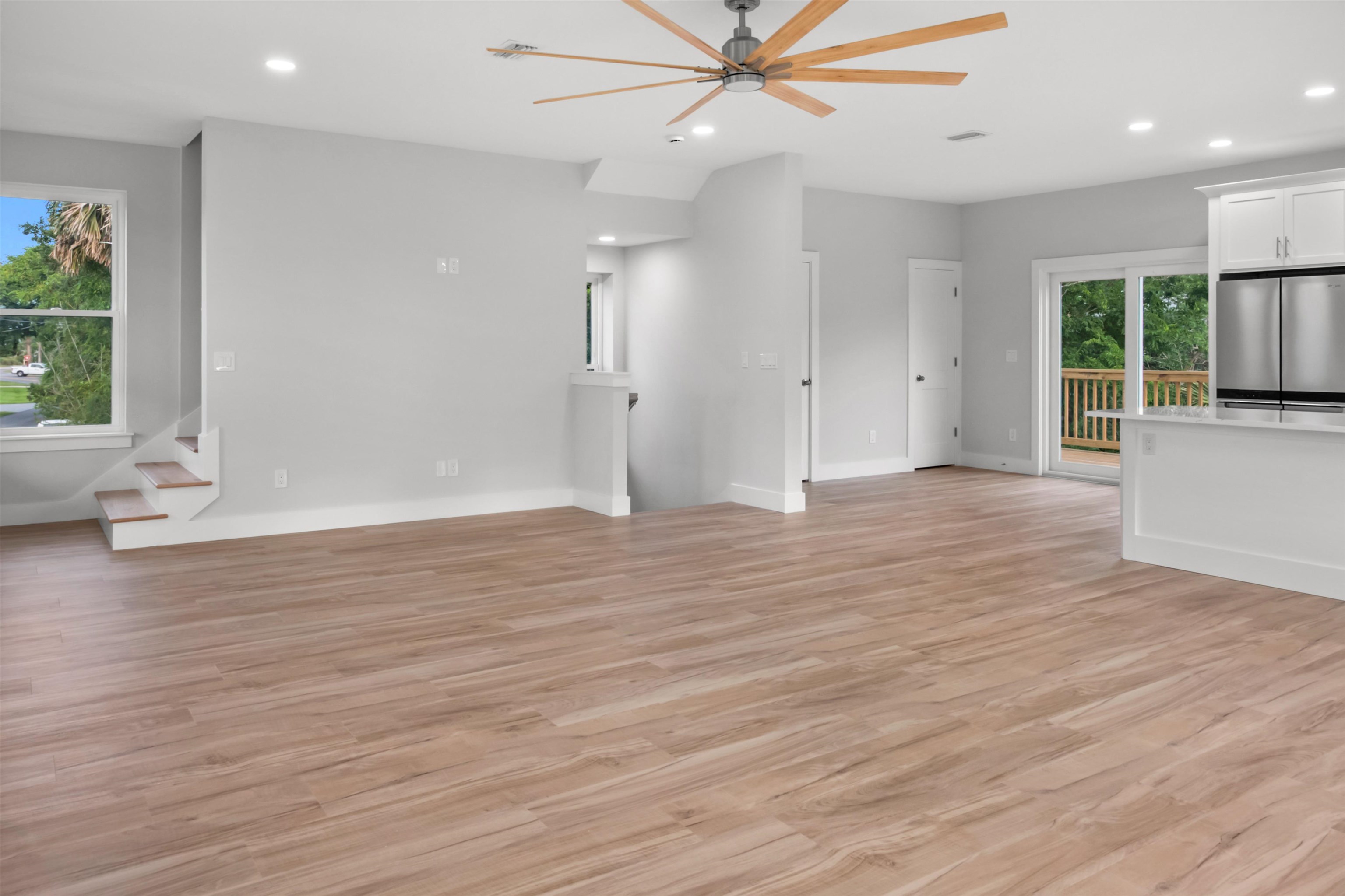 137 Ferrol Road St. Augustine, FL 32084 - Photo 32 of 55 an empty room with wooden floor fan and windows