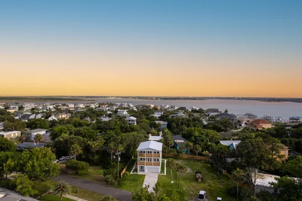 an aerial view of residential building and ocean view