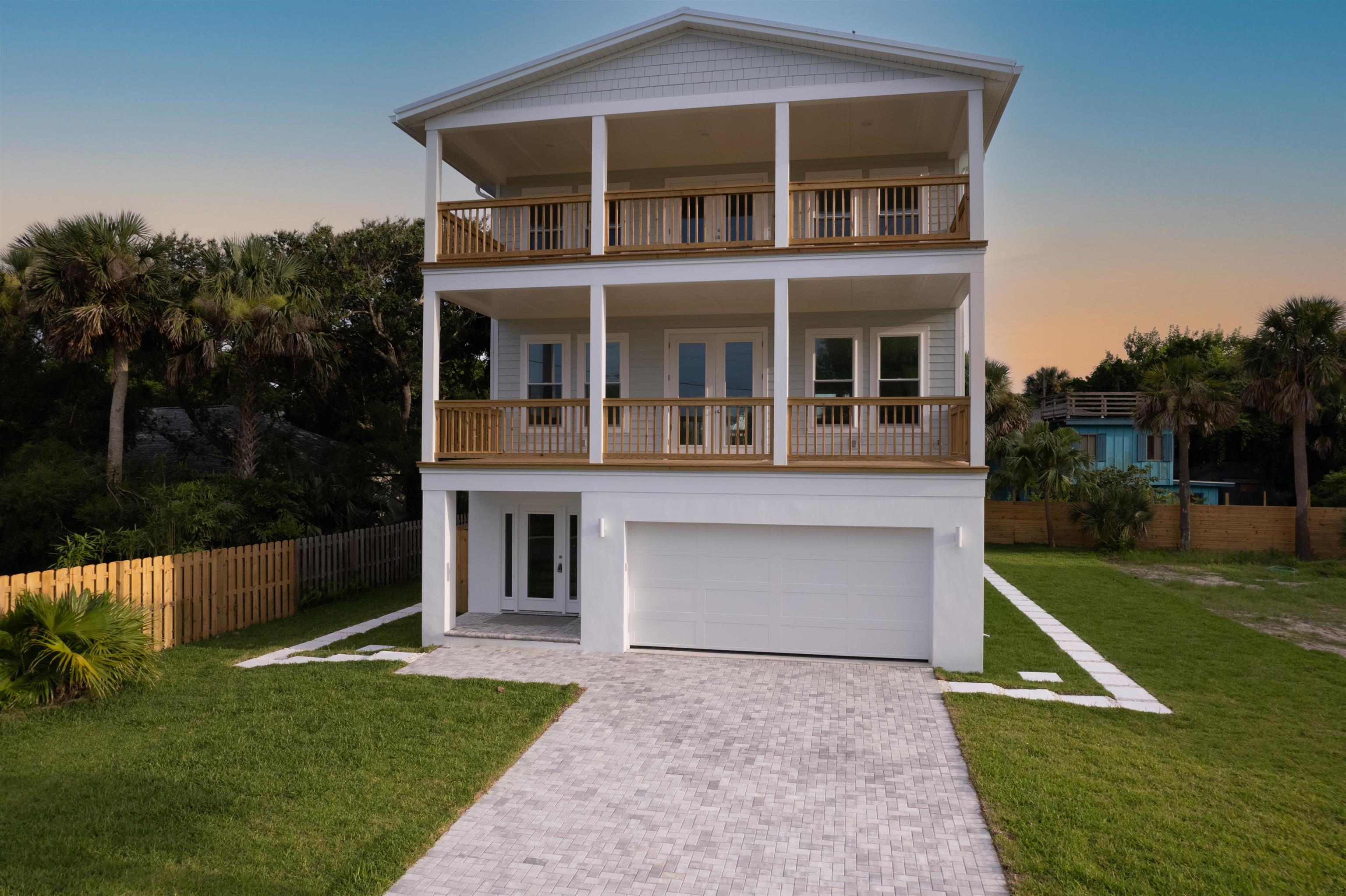 137 Ferrol Road St. Augustine, FL 32084 - Photo 47 of 55 a front view of a house with garden