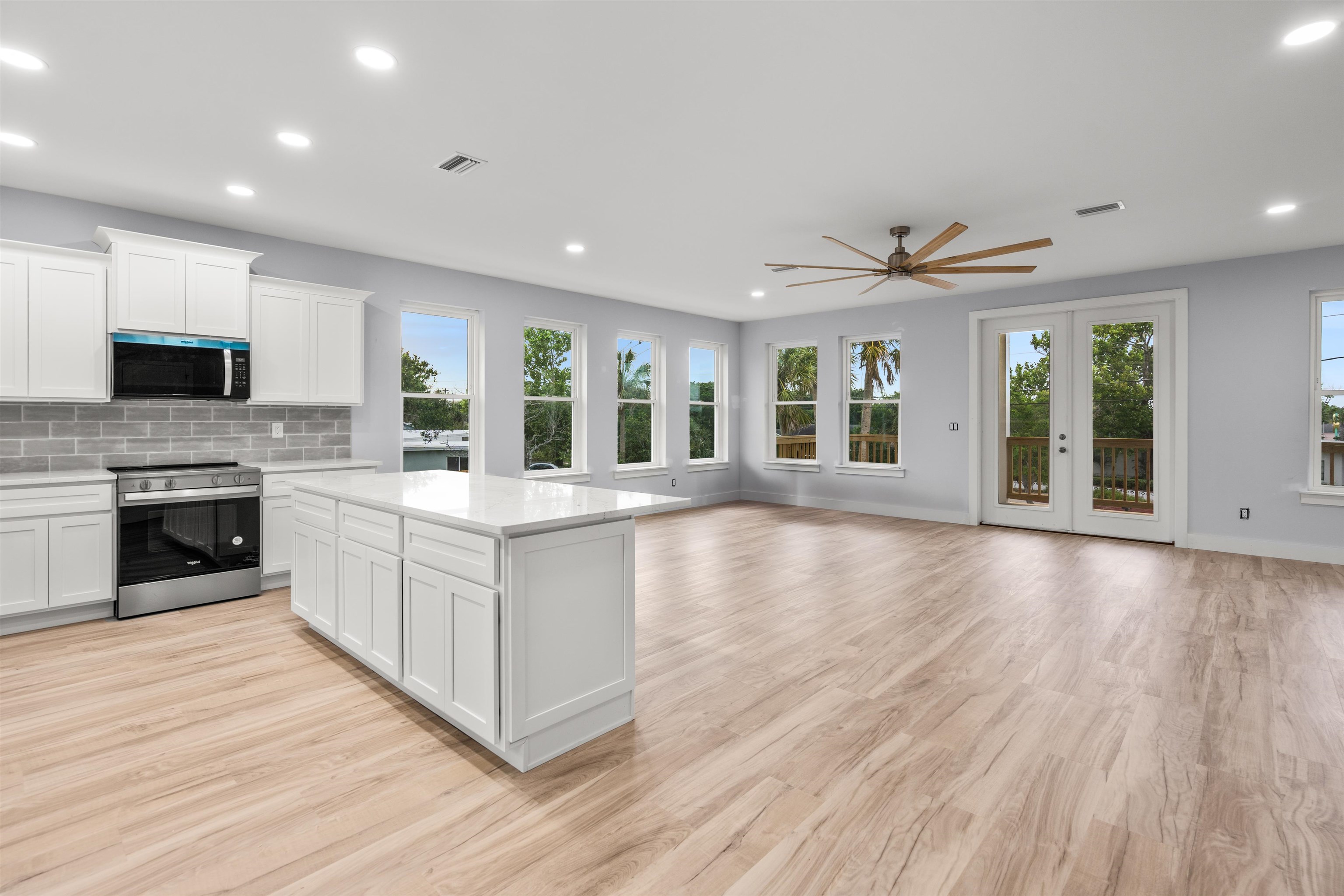 137 Ferrol Road St. Augustine, FL 32084 - Photo 5 of 55 a large kitchen with stainless steel appliances granite countertop a large counter top and a stove
