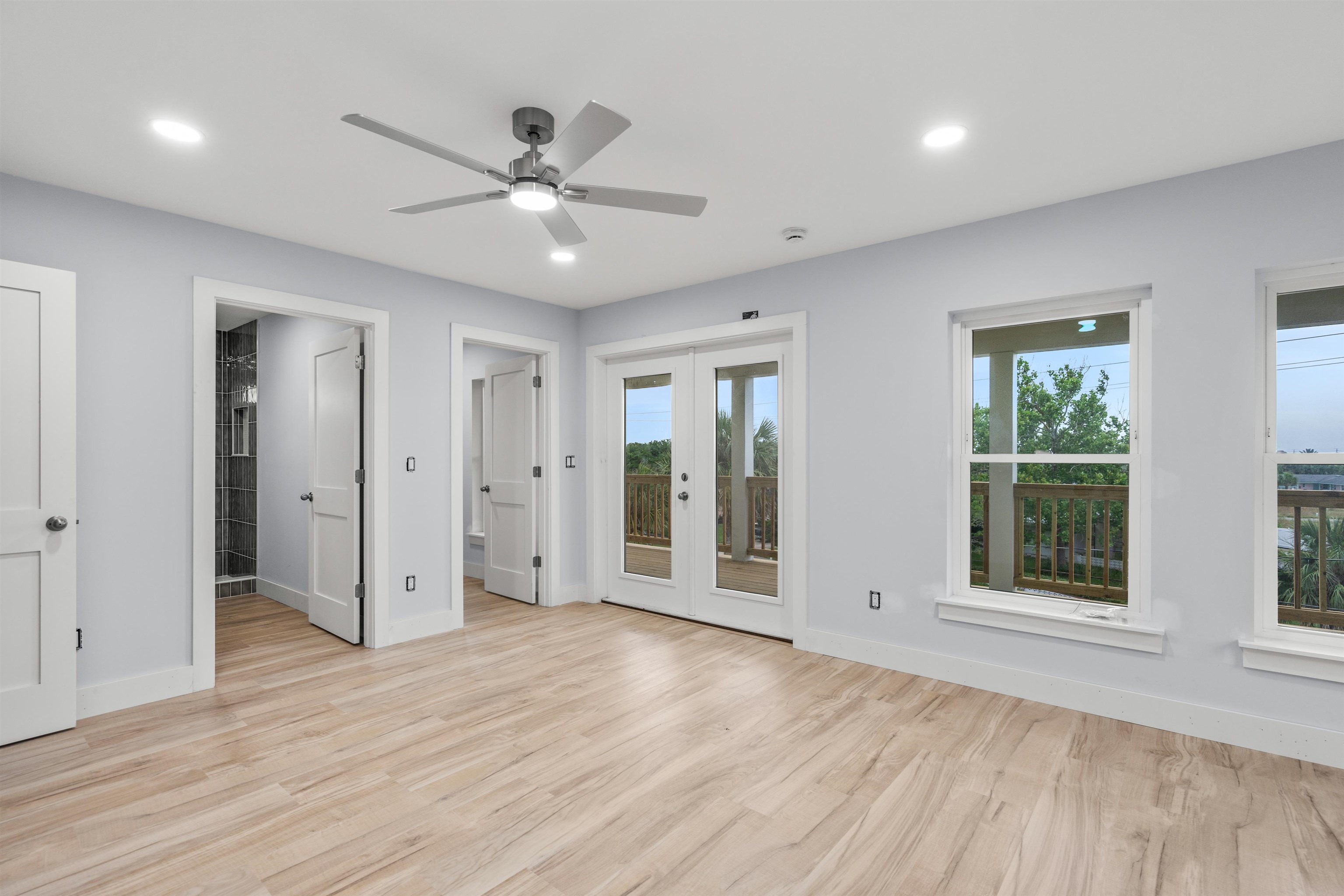 137 Ferrol Road St. Augustine, FL 32084 - Photo 9 of 55 a view of an empty room with wooden floor and window