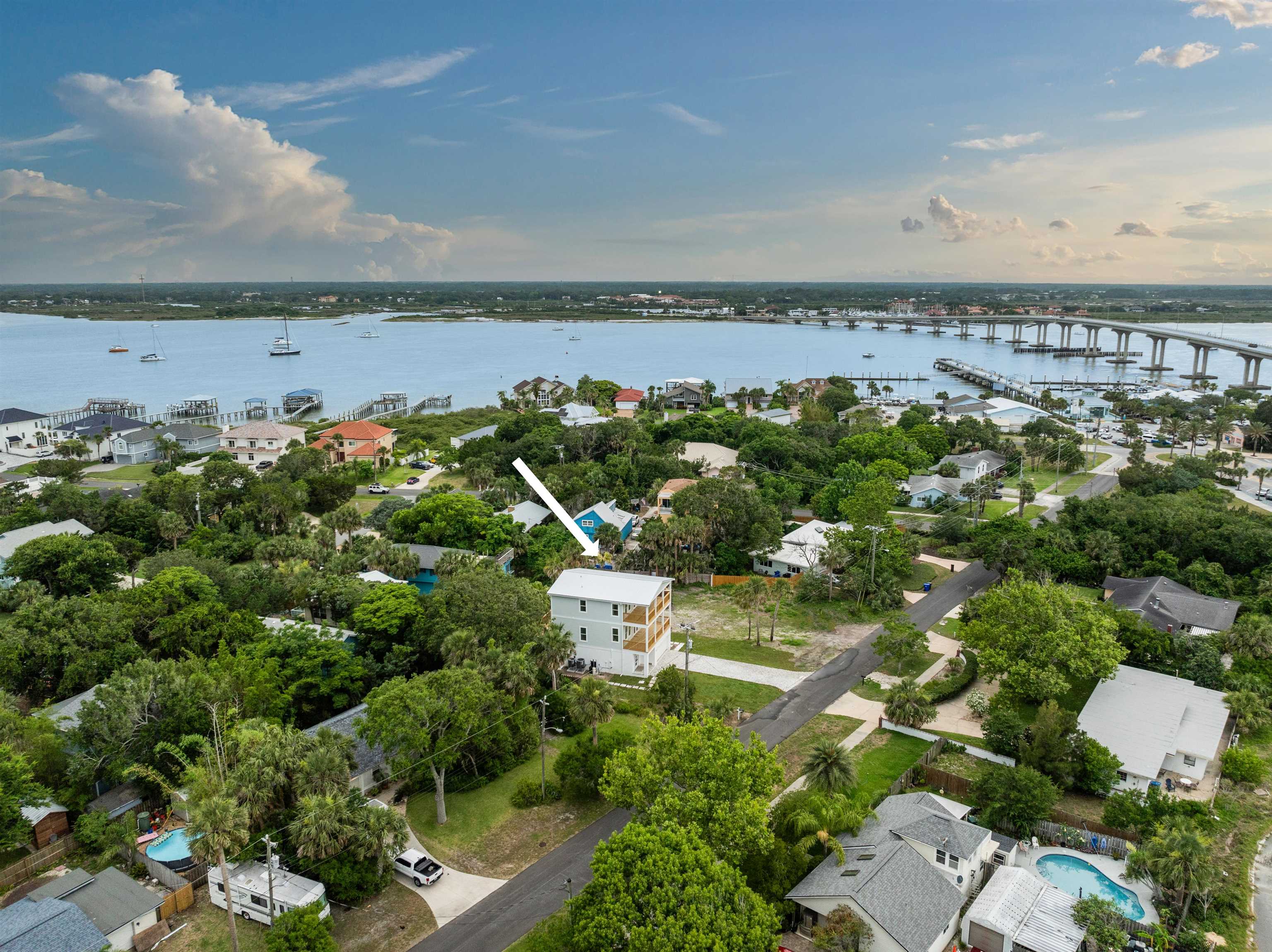 137 Ferrol Road St. Augustine, FL 32084 - Photo 10 of 55 an aerial view of a house with a garden and lake view