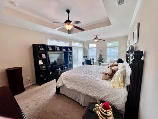 a bed room with a bed and a chair