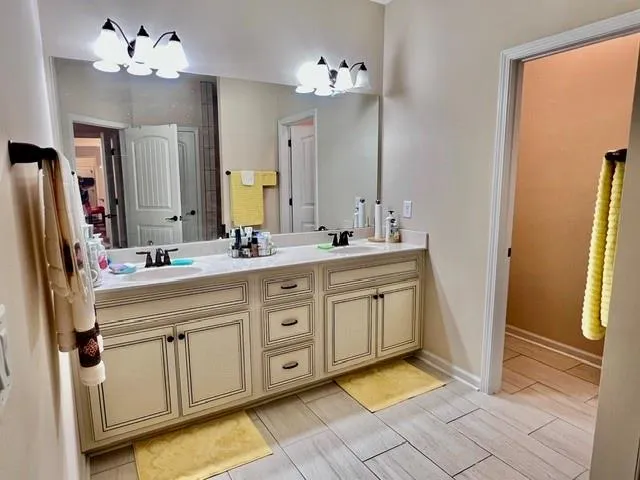 a spacious bathroom with a double vanity sink mirror and a