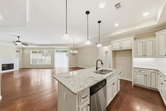 a view of a room with wooden floor