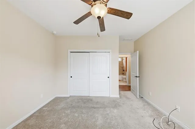 a bathroom with a bathtub shower sink mirror vanity and toilet
