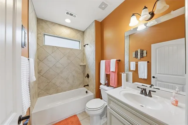 an empty room with a window and a ceiling fan