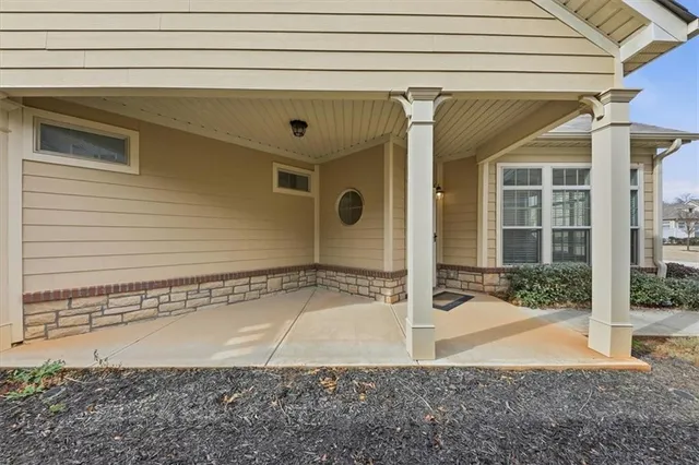 a view of a house with a door and wooden door