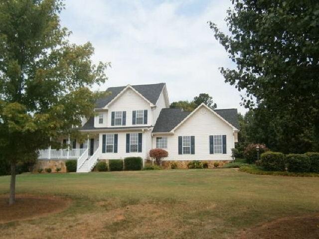 212 Brown Branch Road Locust Grove, GA 30248 - Photo 1 of 1 a front view of a house with a garden