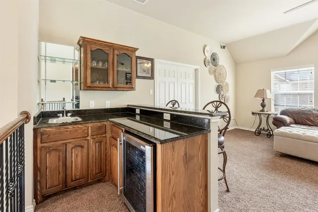 a kitchen with a sink and a stove top oven