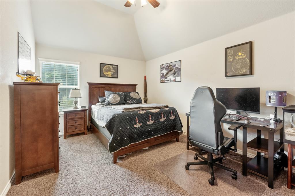 10601 Huffines Drive Rowlett, TX 75089 - Photo 25 of 29 a bedroom with a workspace