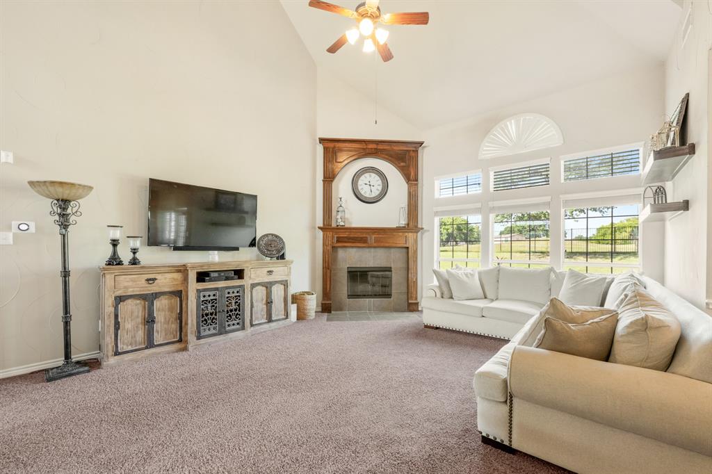 10601 Huffines Drive Rowlett, TX 75089 - Photo 7 of 29 a living room with furniture fireplace and flat screen tv