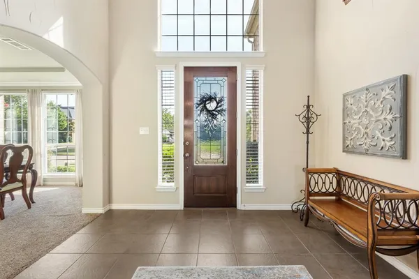 a view of a livingroom with furniture and a window