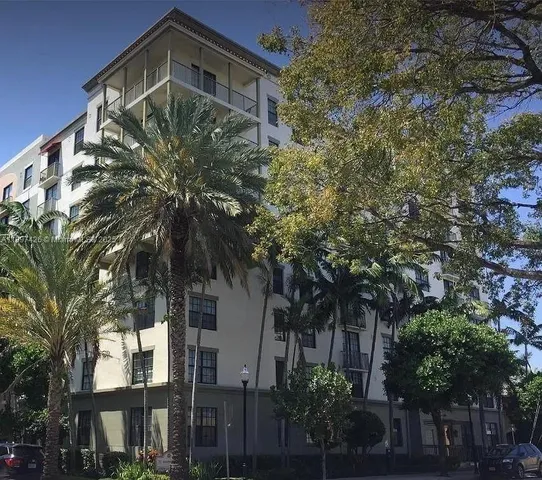 a front view of a house with trees