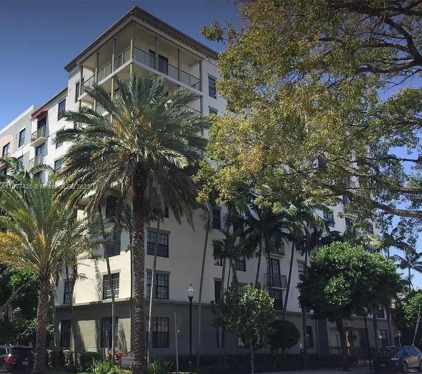 1919 Van Buren Street, Unit 719A Hollywood, FL 33020 - Photo 11 of 17 a front view of a house with trees