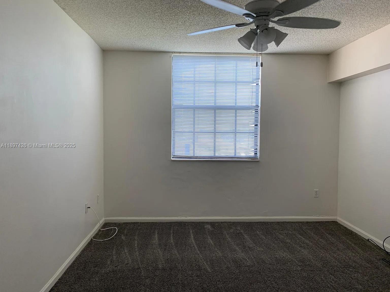 1919 Van Buren Street, Unit 719A Hollywood, FL 33020 - Photo 3 of 17 an empty room with a window