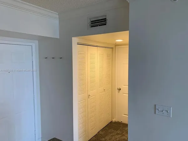 a bathroom with a shower and a door