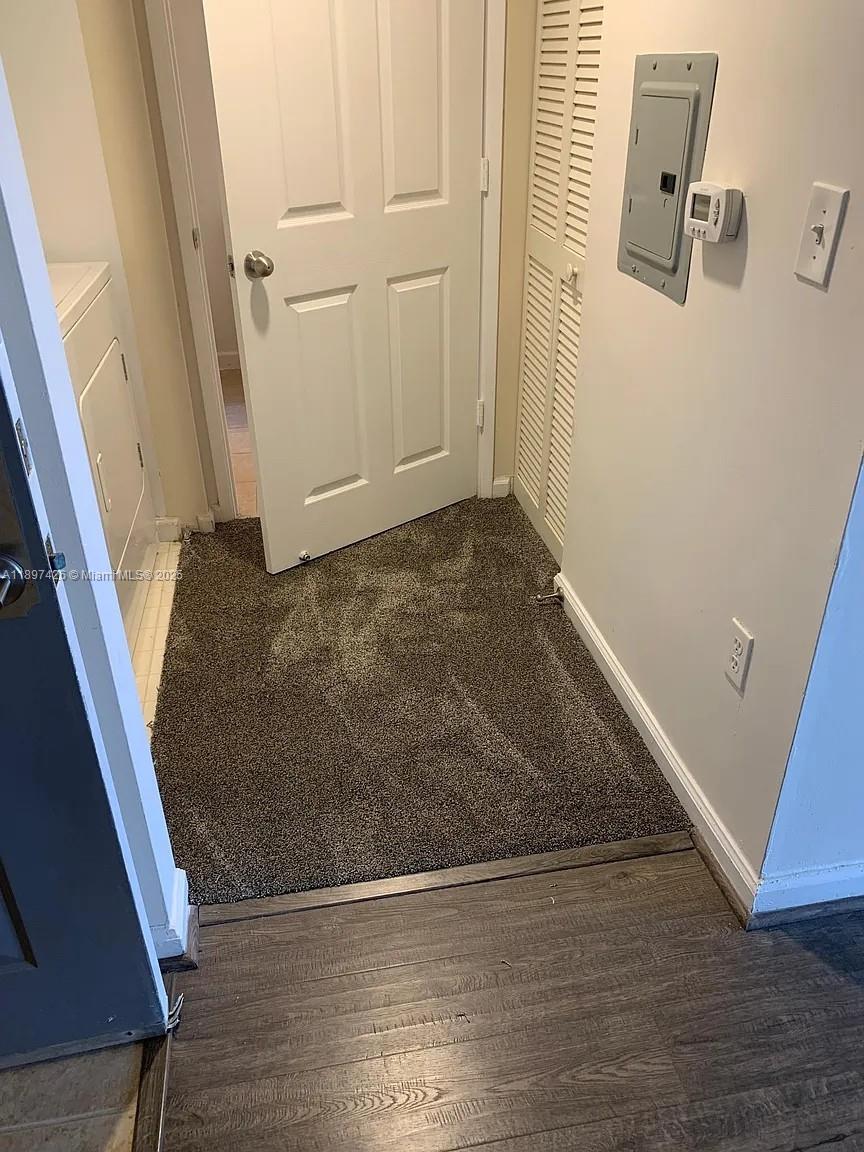 1919 Van Buren Street, Unit 719A Hollywood, FL 33020 - Photo 6 of 17 an empty room with wooden floor and white walls